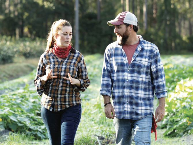 Couple Walking in a field